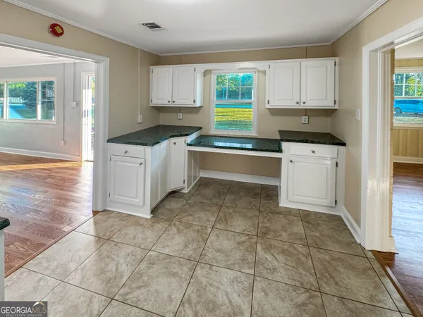 a kitchen with a cabinets and appliances