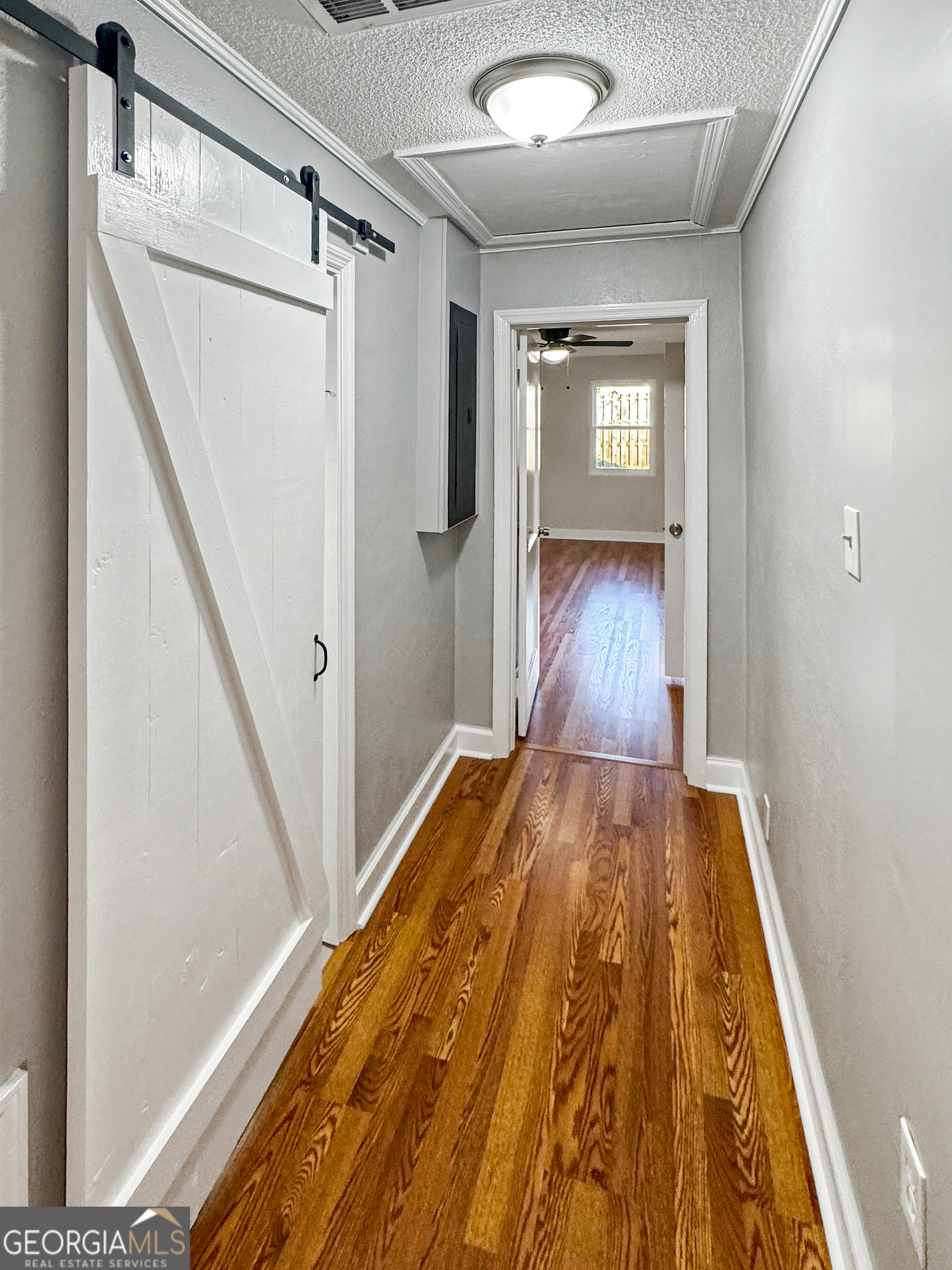 514 Highway 18 Barnesville, GA 30204 - Photo 10 of 15 a view of a hallway with wooden floor and staircase