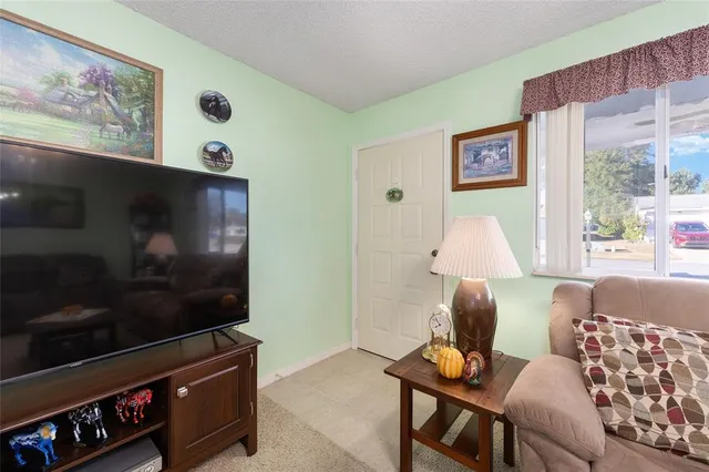 a bathroom with a granite countertop sink mirror vanity and toilet