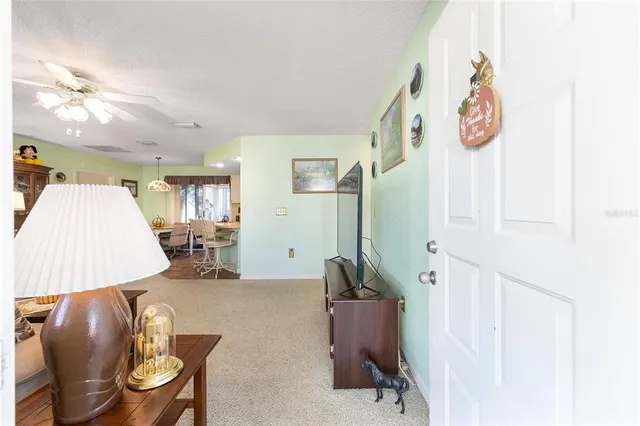 a bedroom with a bed and a lamp