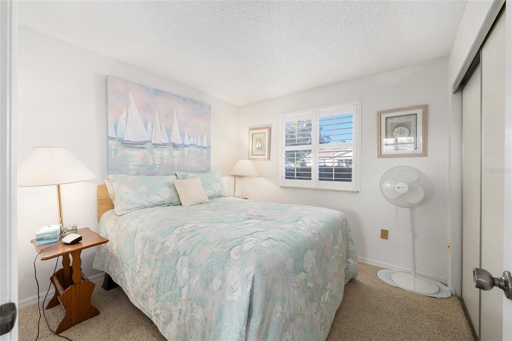 10913 Southwest 83rd Avenue Ocala, FL 34481 - Photo 22 of 48 a bedroom with a bed and a window