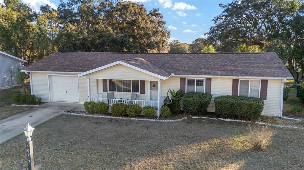 10913 Southwest 83rd Avenue Ocala, FL 34481 - Photo 23 of 48 a front view of a house with a garden