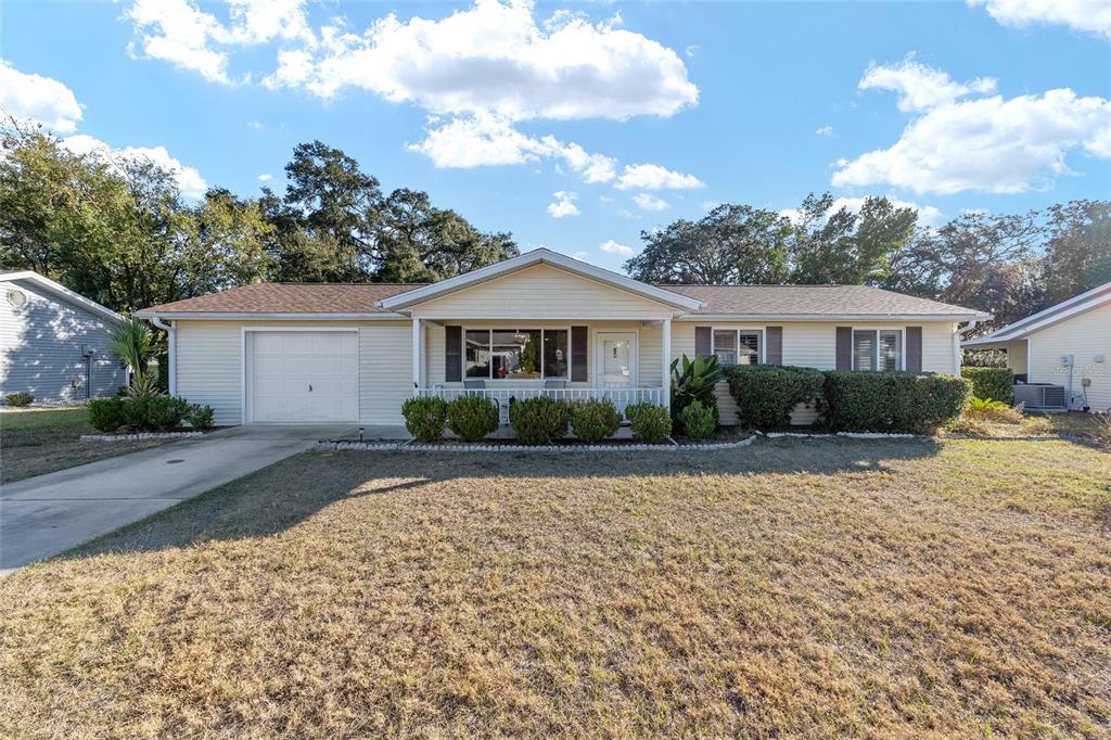 10913 Southwest 83rd Avenue Ocala, FL 34481 - Photo 29 of 48 a front view of a house with a yard