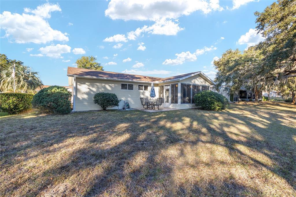 10913 Southwest 83rd Avenue Ocala, FL 34481 - Photo 33 of 48 a front view of a house with a yard