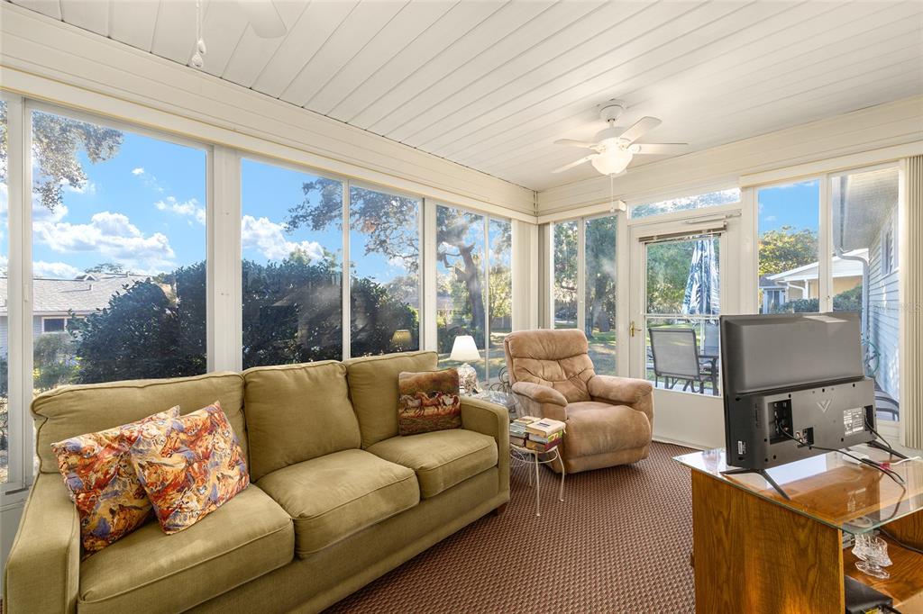 10913 Southwest 83rd Avenue Ocala, FL 34481 - Photo 35 of 48 a living room with furniture and a large window