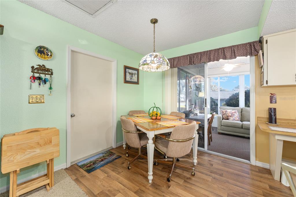 10913 Southwest 83rd Avenue Ocala, FL 34481 - Photo 9 of 48 a dining room with a table and chairs