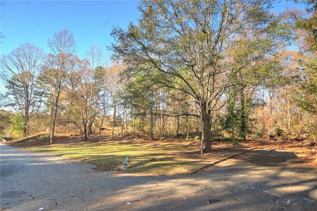 1145 Gun Club Road Northwest Atlanta, GA 30318 - Photo 3 of 10 a view of road with large trees