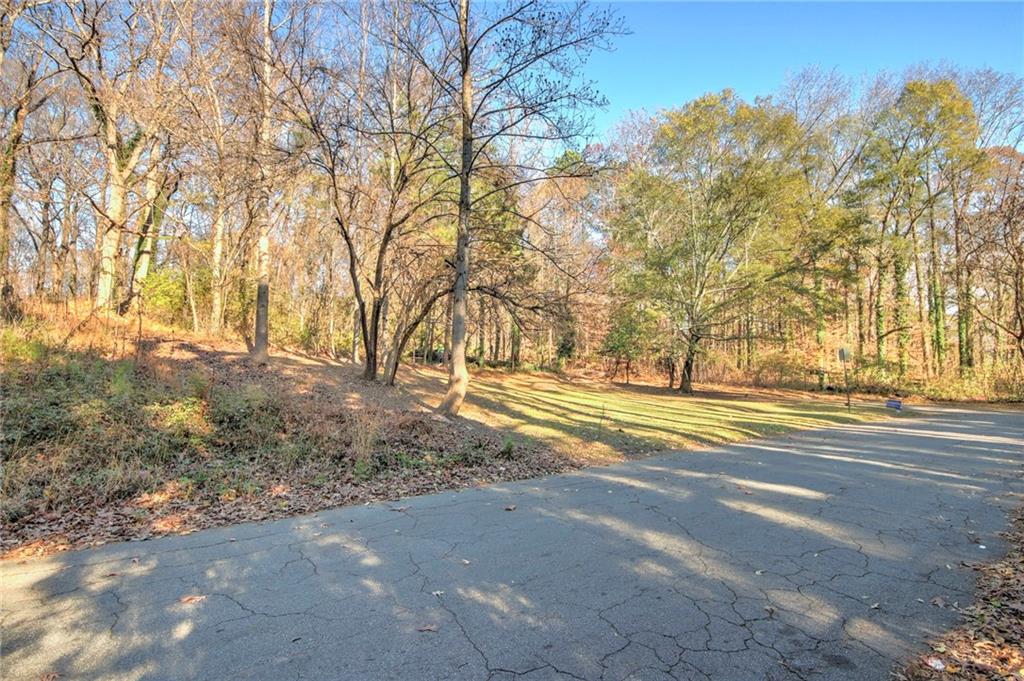 1145 Gun Club Road Northwest Atlanta, GA 30318 - Photo 5 of 10 a view of a yard with large trees