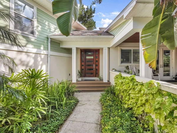 a front view of a house with garden