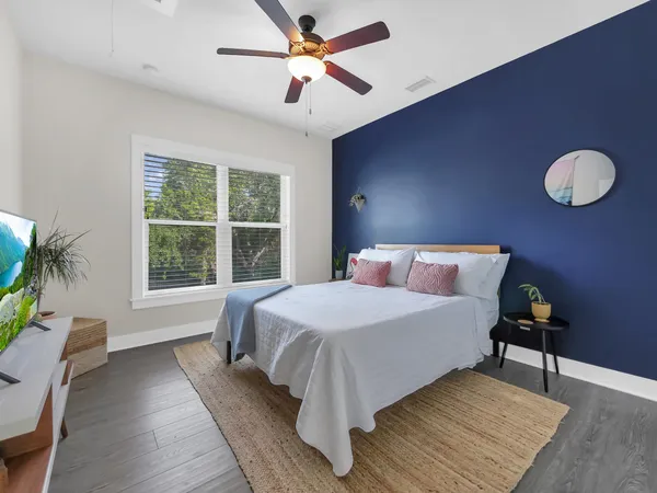 a bed room with a bed and a window