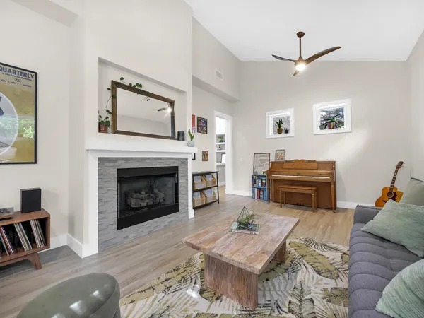 a living room with furniture and a fireplace