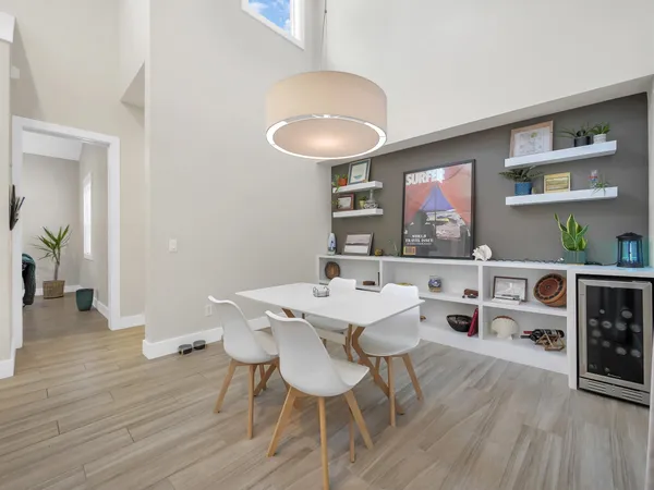 a view of a dining room with furniture and wooden floor