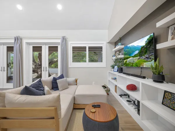 a living room with furniture and a flat screen tv