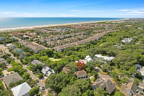 an aerial view of residential houses with outdoor space