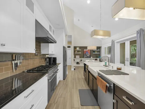 a view of a pathway both side of the house