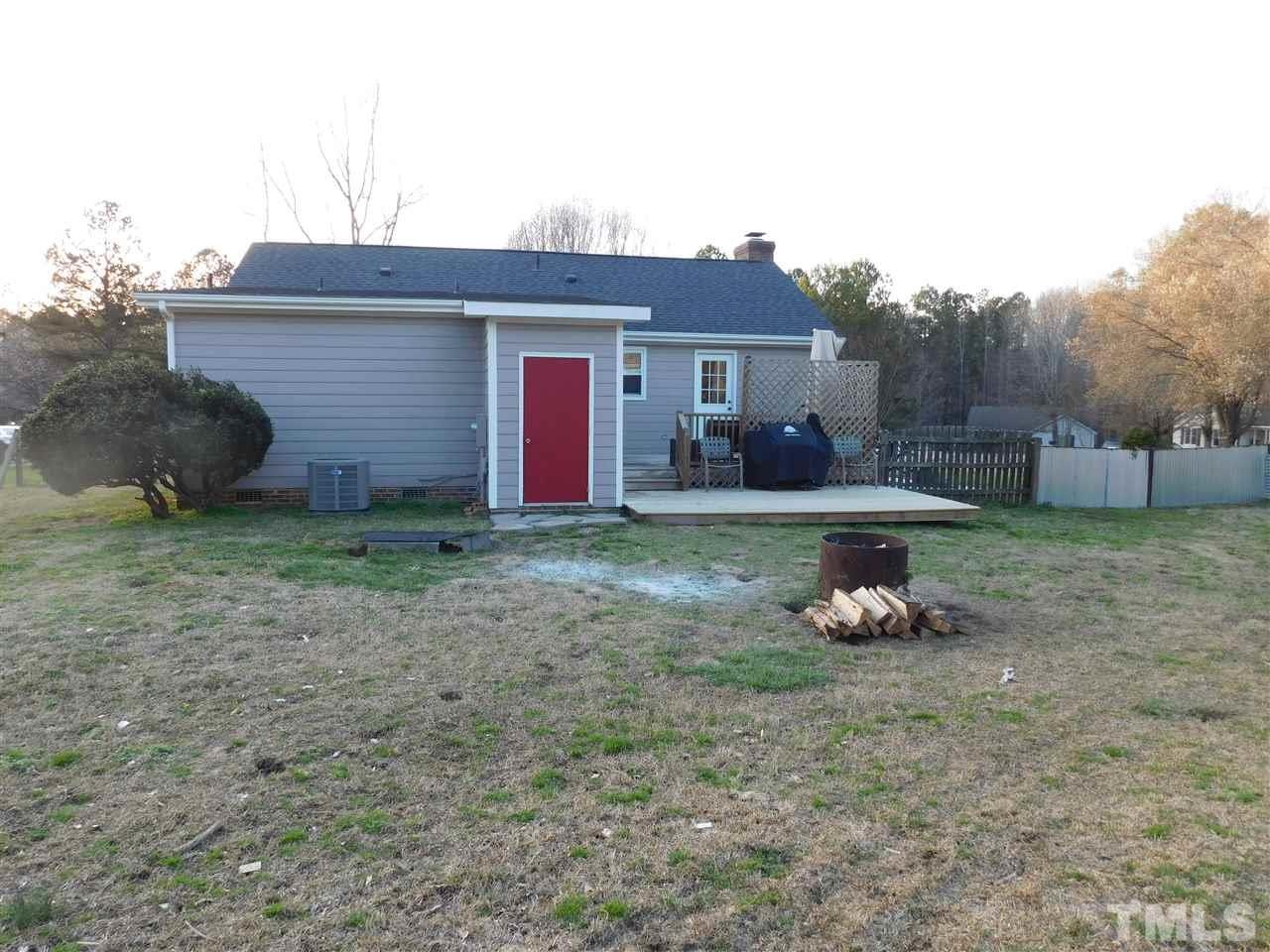 5217 Carrier Way Raleigh, NC 27603 - Photo 14 of 18 Fully fenced back yard with double deck and storage room.