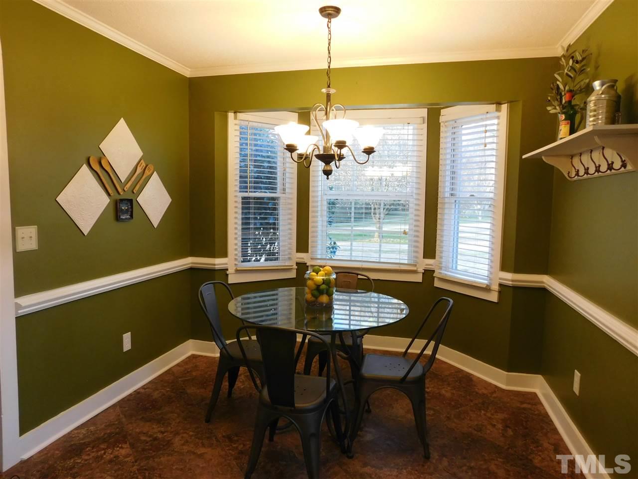 5217 Carrier Way Raleigh, NC 27603 - Photo 5 of 18 Breakfast nook with bay-window is full of light.
