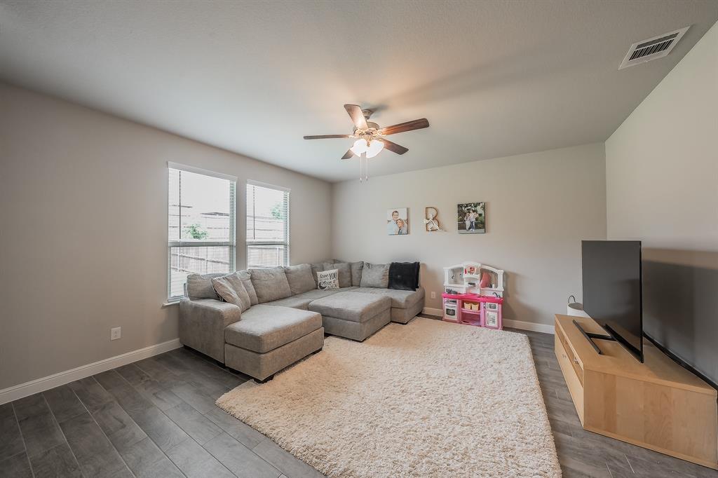 1212 Bosque Lane Weatherford, TX 76087 - Photo 10 of 38 a living room with furniture and a flat screen tv
