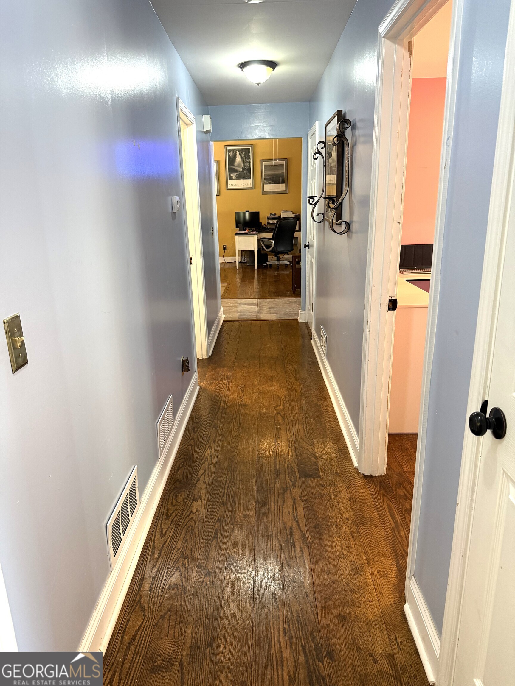 725 Musgrove Road Griffin, GA 30223 - Photo 19 of 52 a view of a hallway with wooden floor and staircase