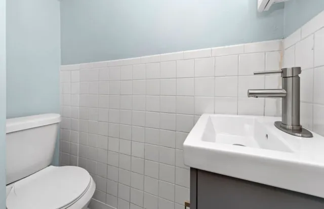 a bathroom with a sink and toilet
