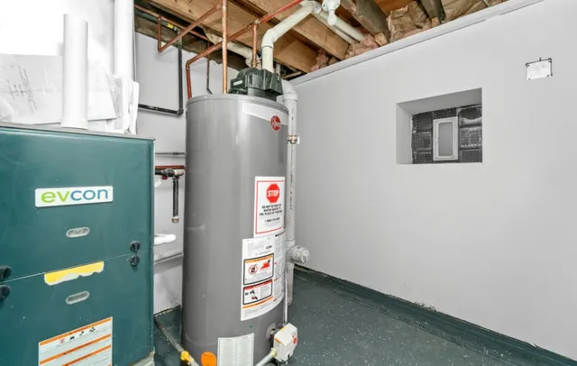 a view of storage and utility room with closet
