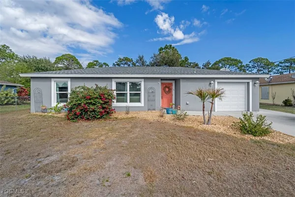 front view of house with potted plants