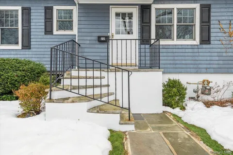 a view of a pathway with a house