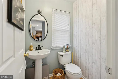 a living room with furniture and a book shelf