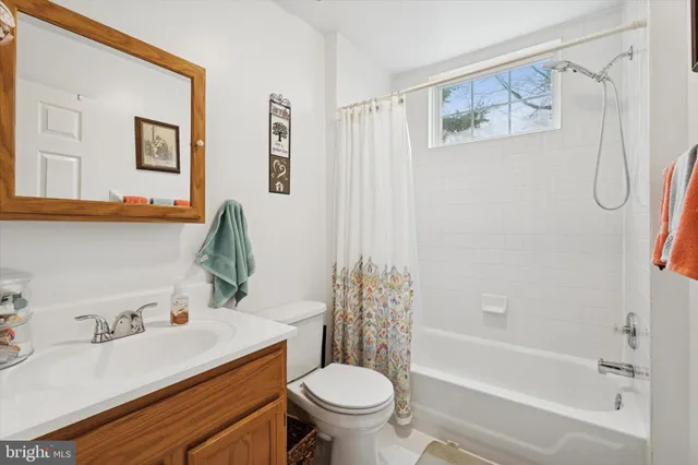 a bedroom with a bed and a fireplace