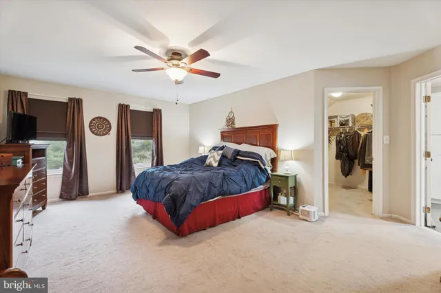 a bed room with a bed and a television