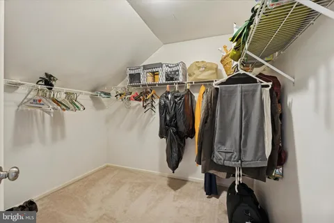 a spacious bathroom with double sink and a mirror