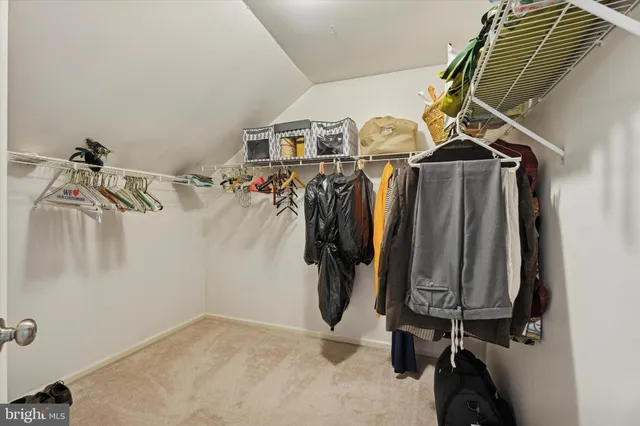 a spacious bathroom with double sink and a mirror