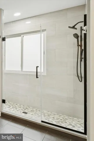 a bathroom with a shower and a toilet
