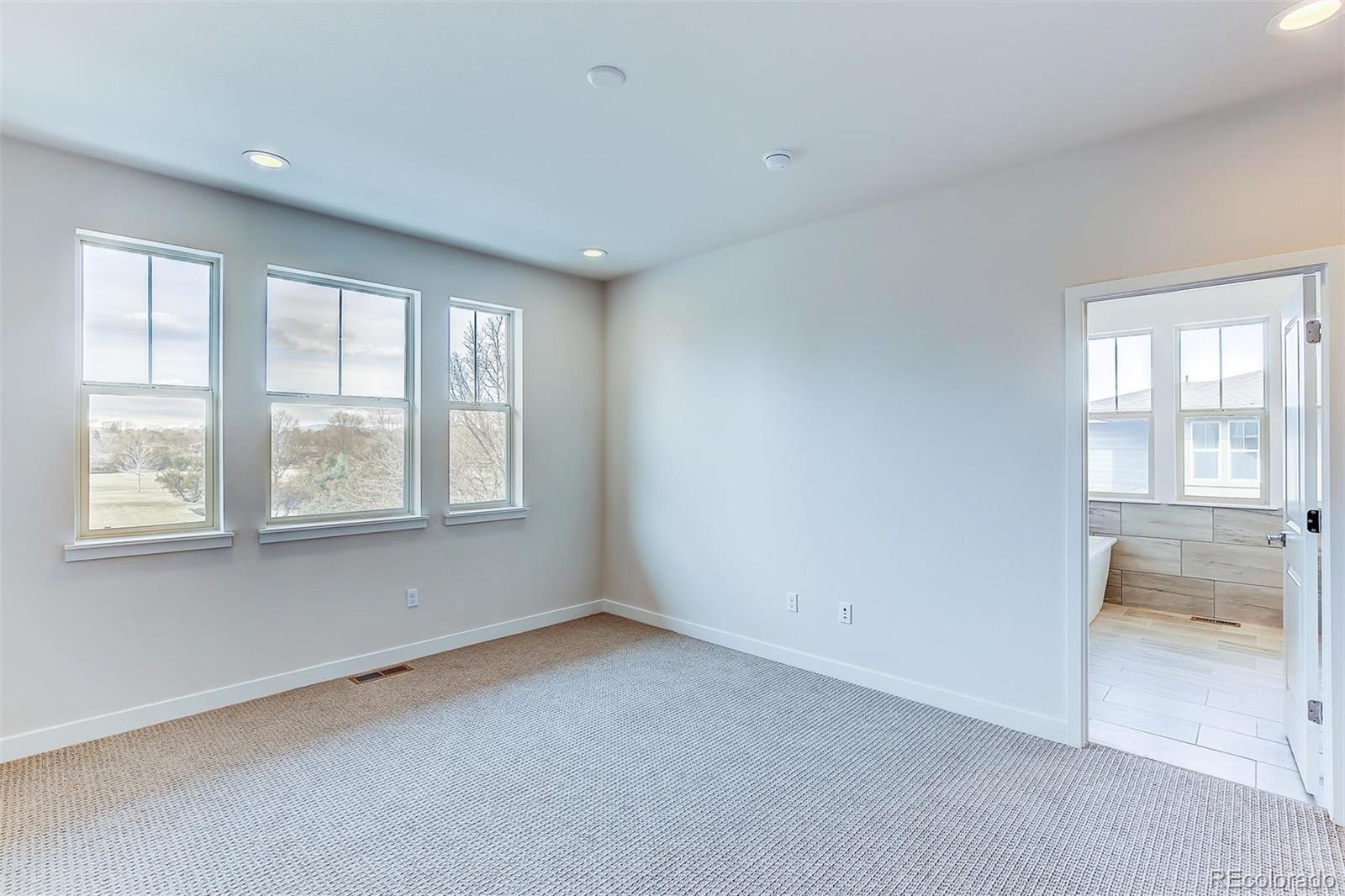 192 South Locust Street Denver, CO 80224 - Photo 12 of 18 a view of an empty room with a window