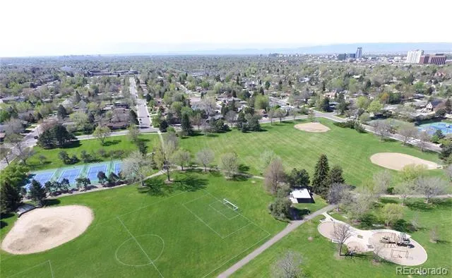 a view of a park with large trees