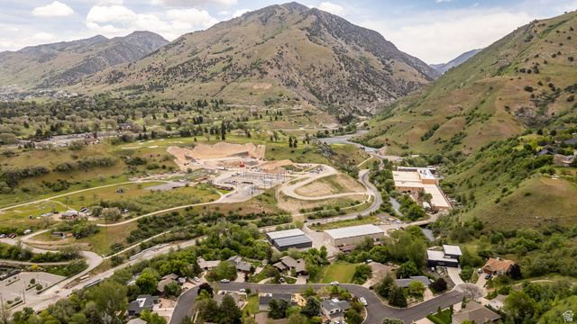 1552 Sumac Drive Logan, UT 84321 - Photo 59 of 72 Expansive aerial perspective showcasing a mountainous terrain with lush green slopes and a meandering river