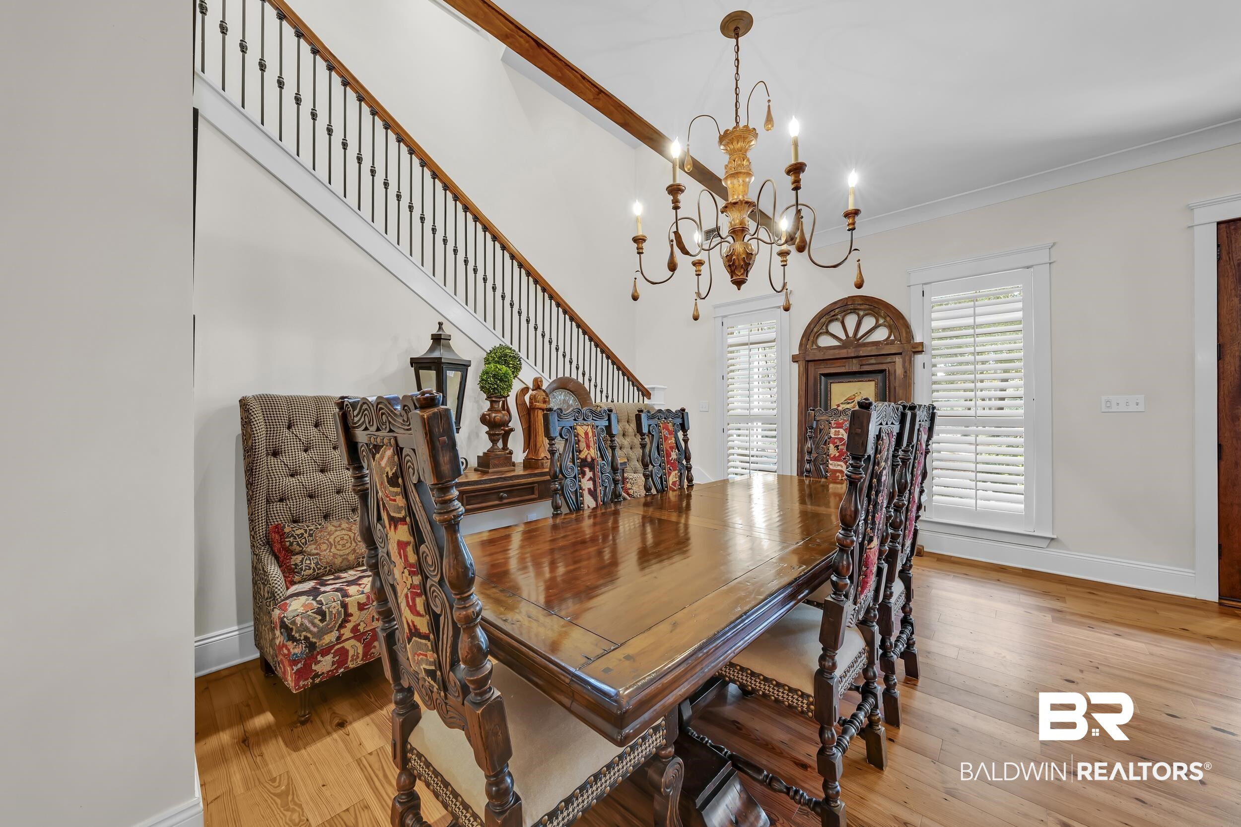 12161 Jessamine Street Magnolia Springs, AL 36555 - Photo 10 of 70 Dining area featuring light wood finished floors, a chandelier, and ornamental molding