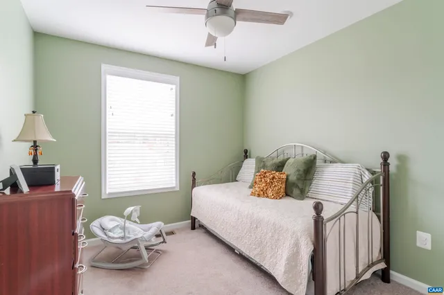 a bathroom with a sink mirror vanity and toilet