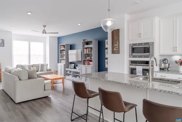 a living room with fireplace furniture and a flat screen tv