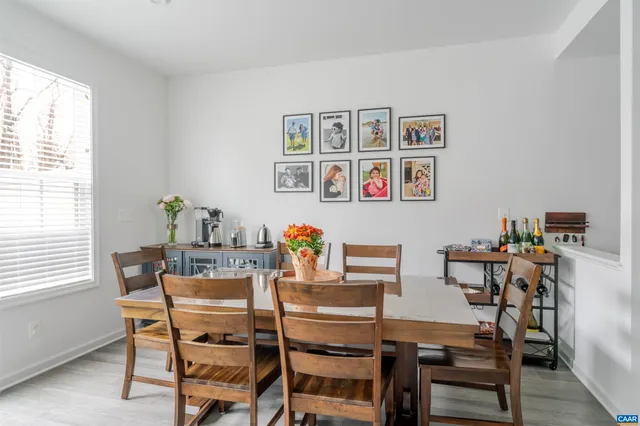 a view of a dining room with furniture and window