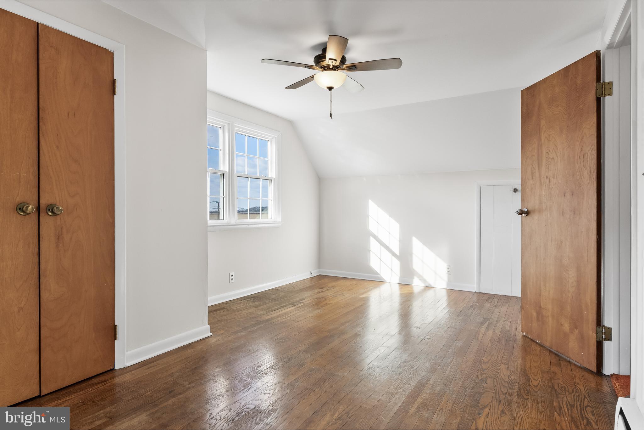23 Pemberton Vincentown Road Pemberton, NJ 08068 - Photo 26 of 46 a view of an empty room with wooden floor and a window