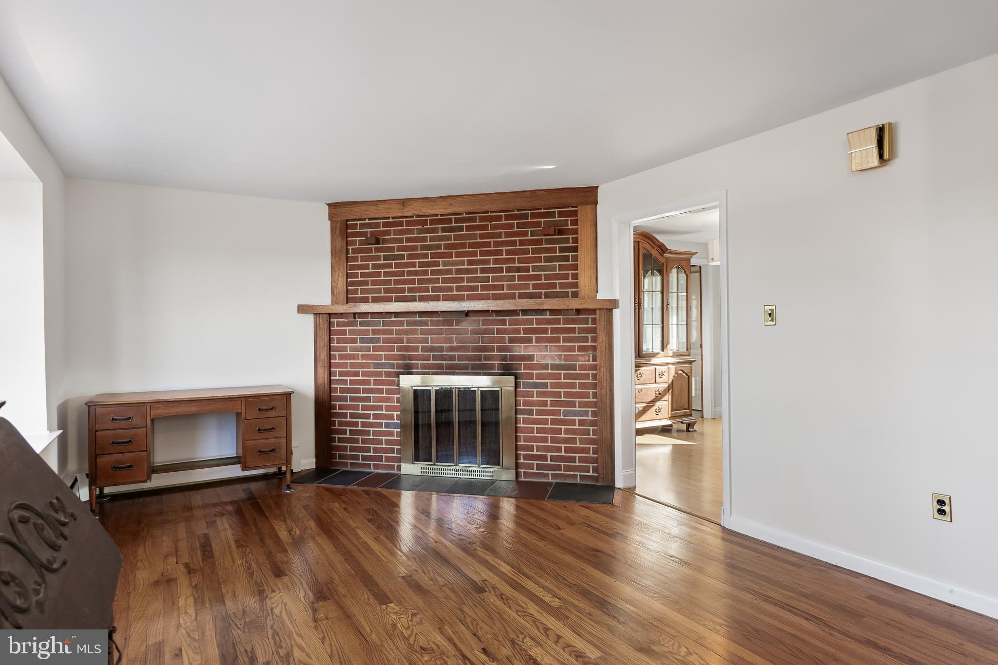 23 Pemberton Vincentown Road Pemberton, NJ 08068 - Photo 4 of 46 a view of an empty room with fire place and wooden floor