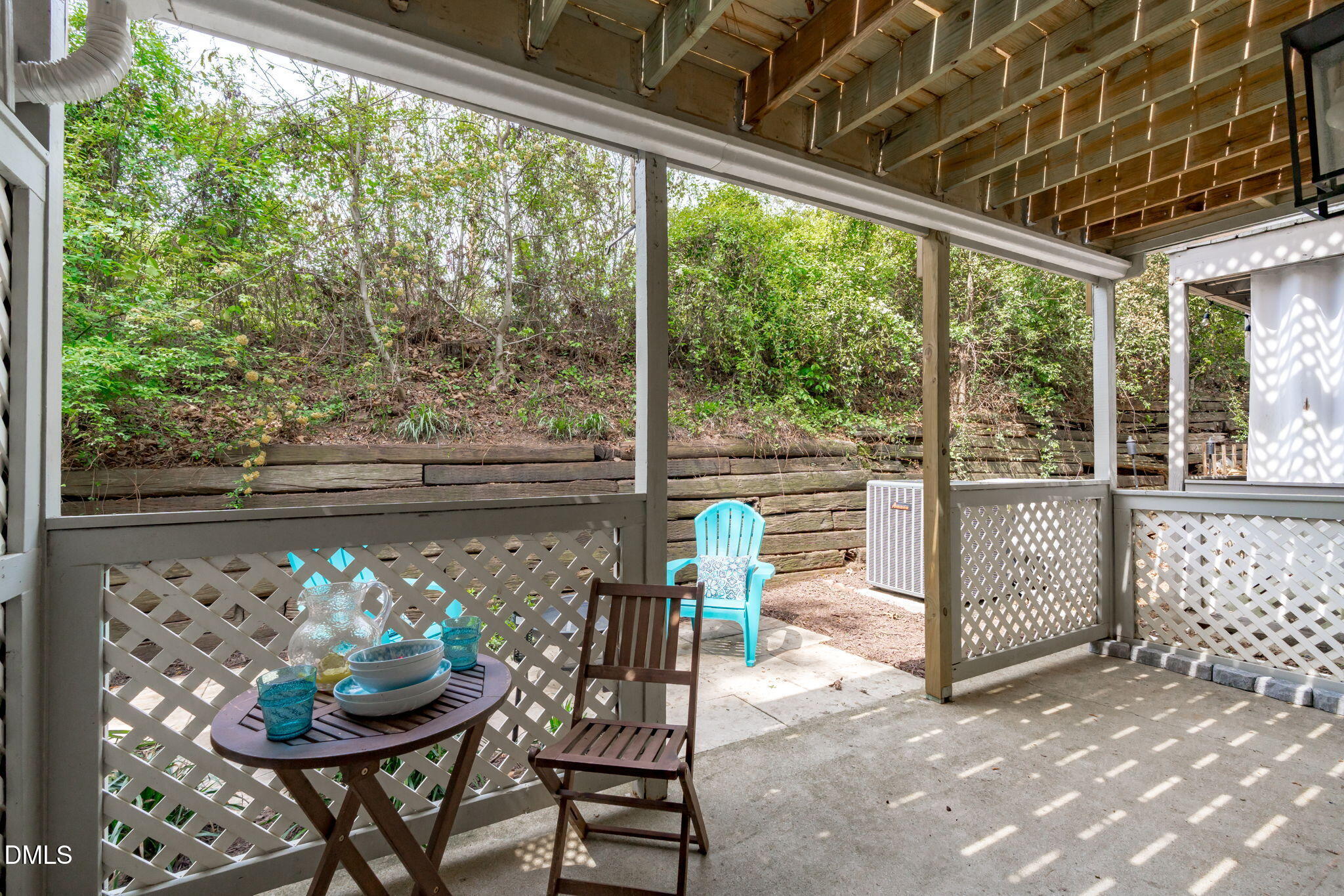 203 Oak Hollow Court Raleigh, NC 27613 - Photo 32 of 37 a view of a porch with furniture and a yard