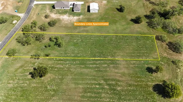 a view of a green field with clear sky