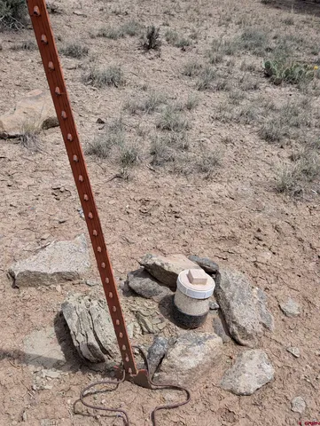 a view of a backyard with furniture