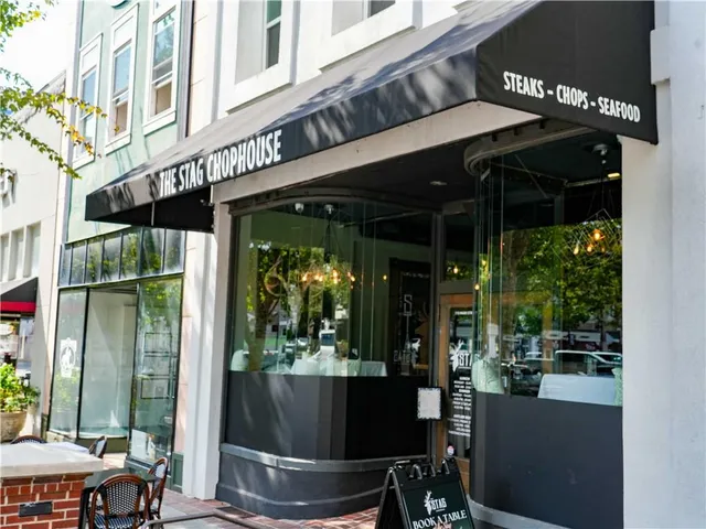 a view of a shop in a street