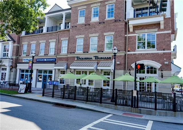 a bathroom with a double vanity sink toilet mirror and bathtub