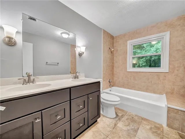 a view of an entryway with a floor to ceiling window