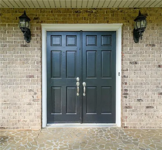 a view of a house with a tree in the background