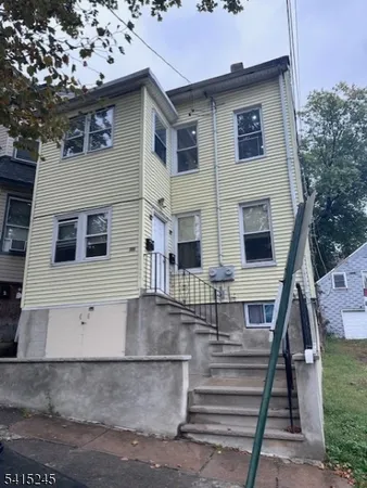 a front view of a house with street